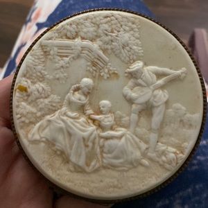 Rare Vintage cameo carve out powder mirror.